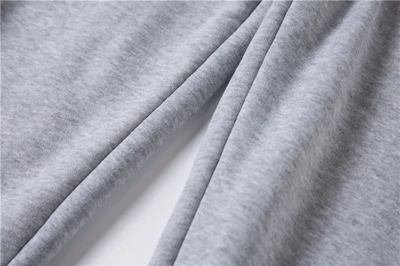 Close-up of gray fabric with folds on a white background