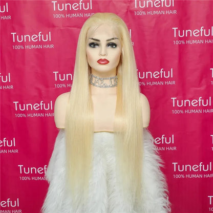 Blonde wig on a mannequin head with a pink background featuring the 'Tuneful' brand.