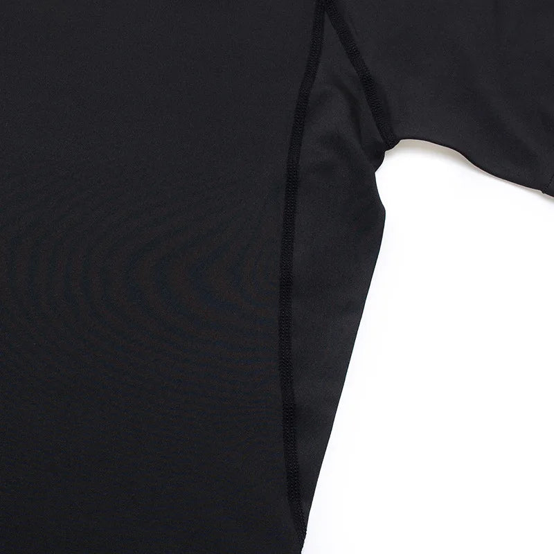 Close-up of a black long-sleeve shirt on a white background
