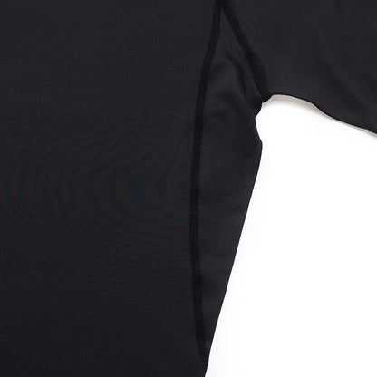 Close-up of a black long-sleeve shirt on a white background