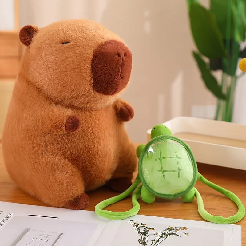 Plush bear toy with a green turtle toy on a wooden surface