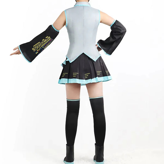 Person wearing a black and light blue outfit with long sleeves and a skirt on a white background