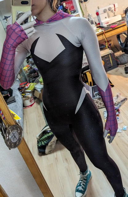 Person wearing a Spider-Man costume in a workshop setting