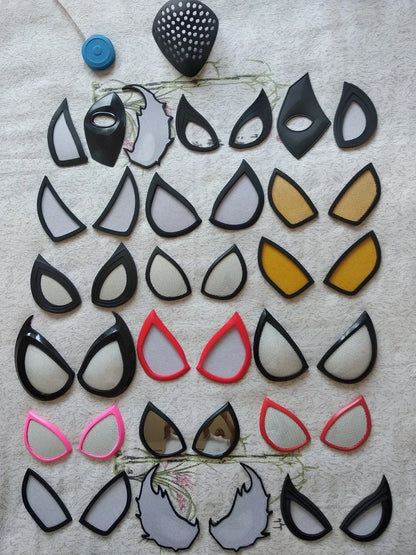 Collection of various shaped earrings on a textured surface