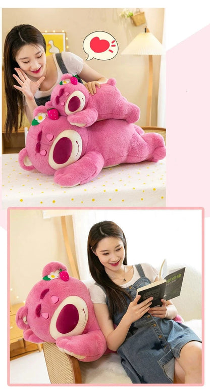 Pink plush toy with a heart on a white background