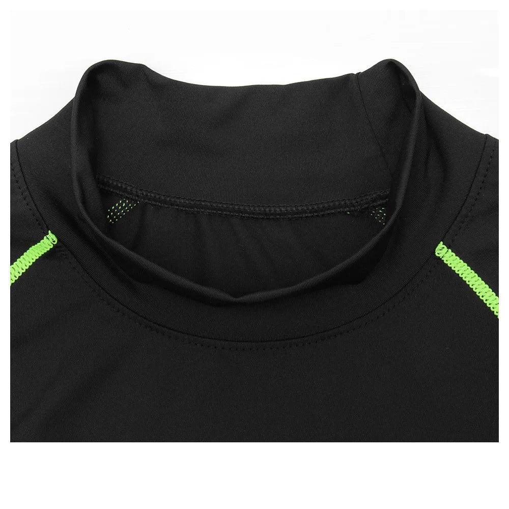 Close-up of a black shirt with green accents on a white background