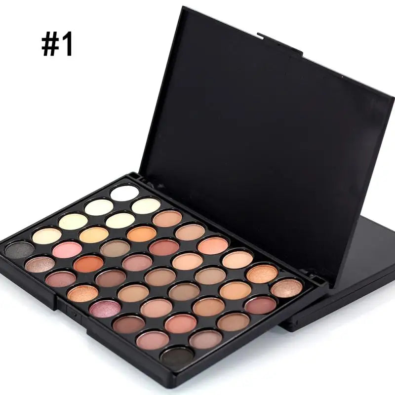 Makeup palette with various shades of eyeshadows on a white background