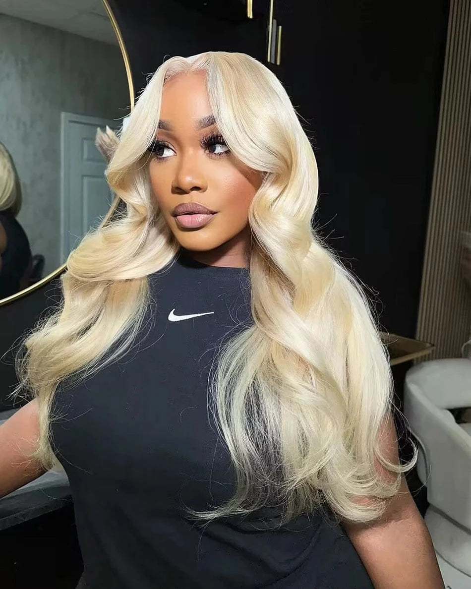 Woman with long blonde hair wearing a black Nike shirt indoors.