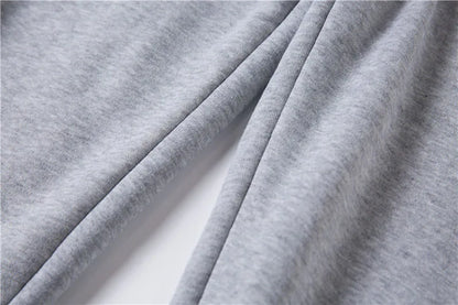 Close-up of gray fabric with folds on a white background