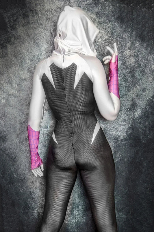 Person wearing a black bodysuit with white accents and pink gloves against a gray textured background