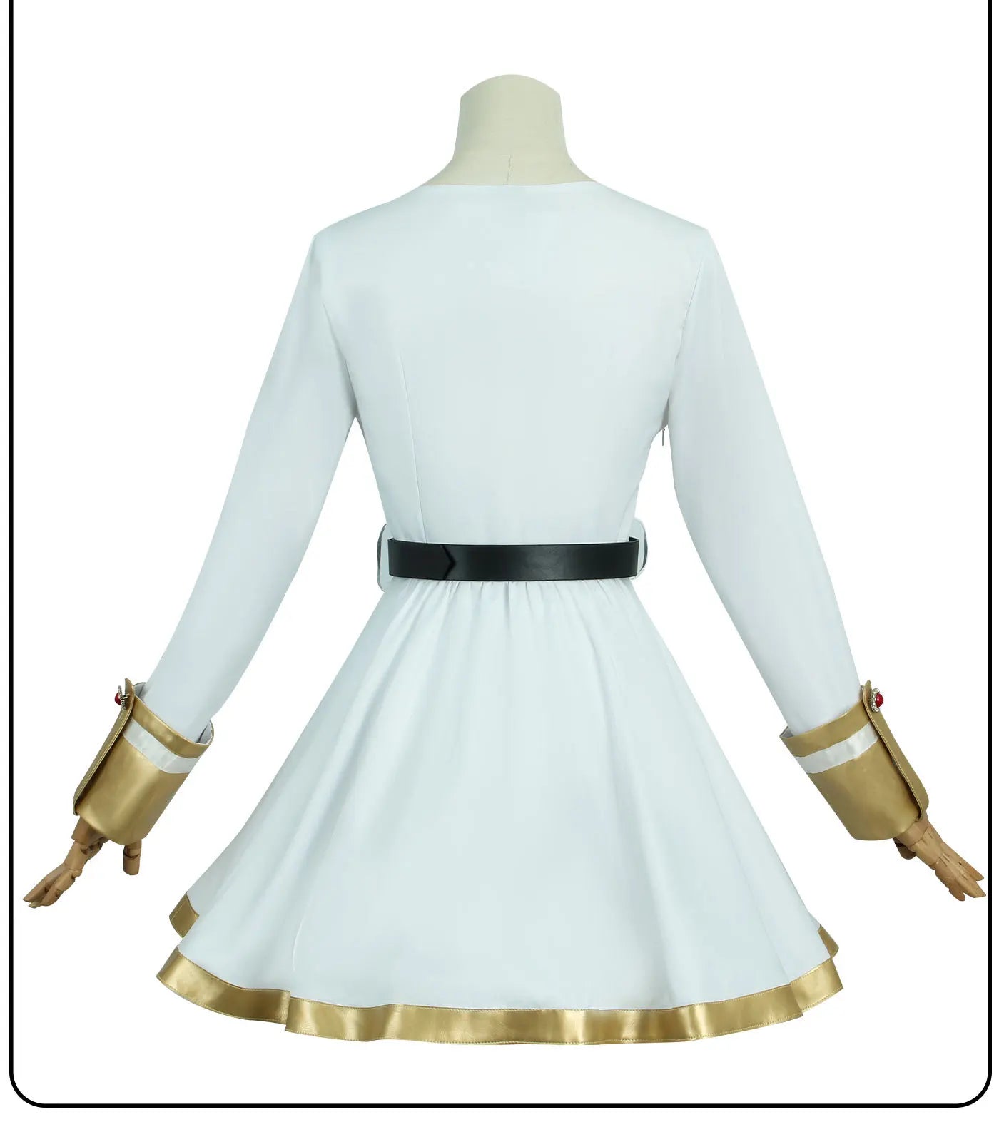 White dress with gold accents on a mannequin against a white background