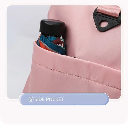 Pink backpack with a side pocket containing an umbrella on a light gray background