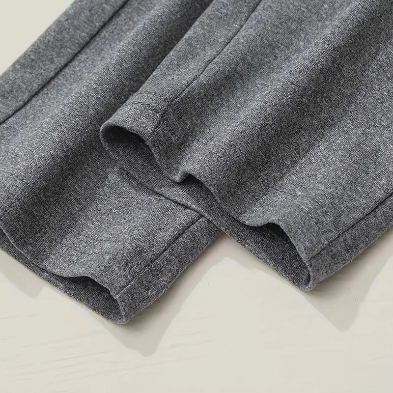 Close-up of gray shorts on a light beige background