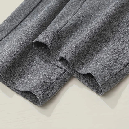 Close-up of gray shorts on a light beige background