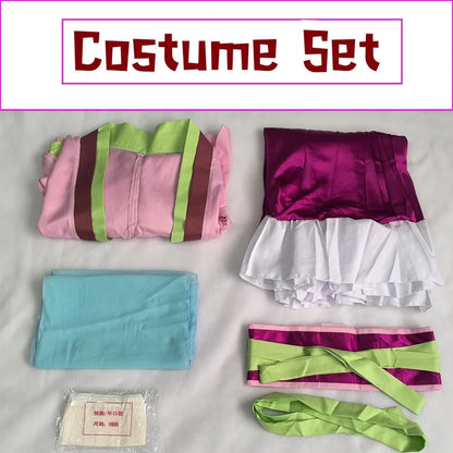 Costume set with pink and green striped fabric, purple and white top, blue fabric, and a small package on a light gray background.
