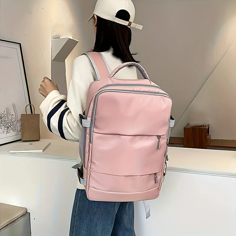 Person wearing a pink backpack in an indoor setting