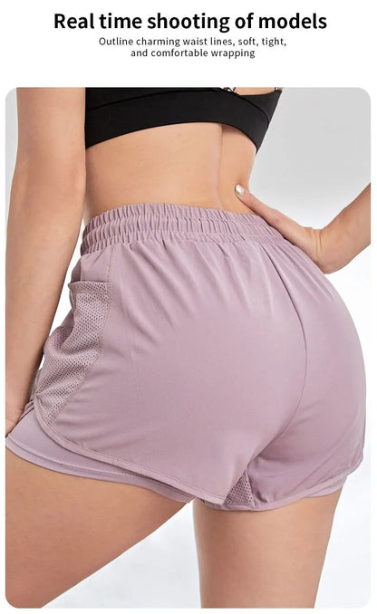 Person wearing a black sports bra and light purple shorts on a white background