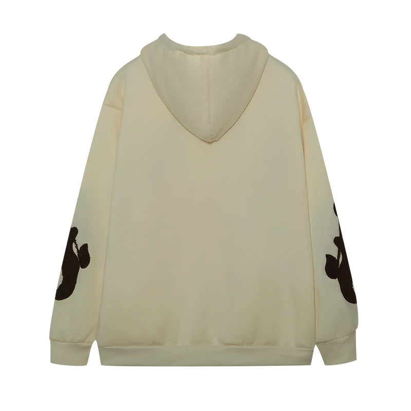 Beige hoodie with black designs on sleeves on a white background