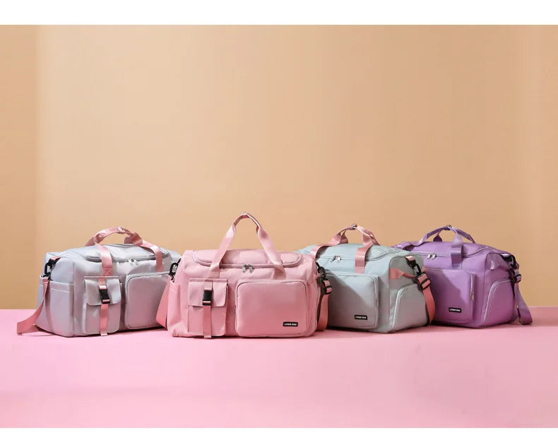 Four colorful bags arranged in a row on a pink surface with a beige background