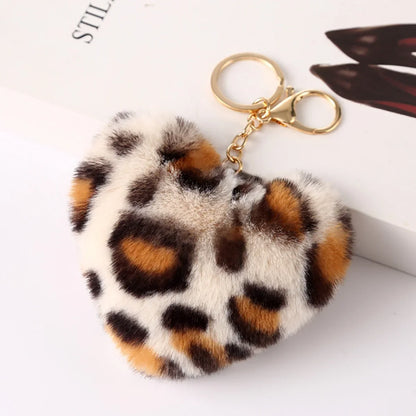 Heart-shaped leopard print keychain on a white background