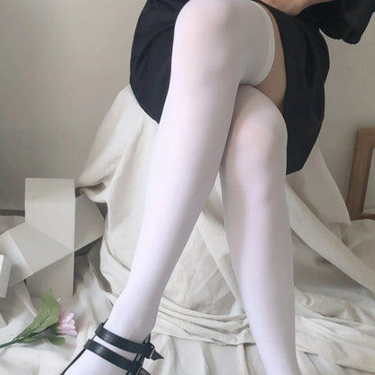 Soft cotton over-the-knee socks for women – breathable thigh-high stockings in black, white, or pink, perfect for school outfits, cosplay, and cozy fall fashion.