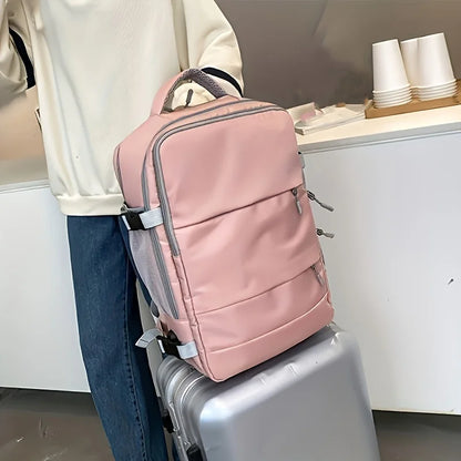Pink backpack on a suitcase with a blurred background