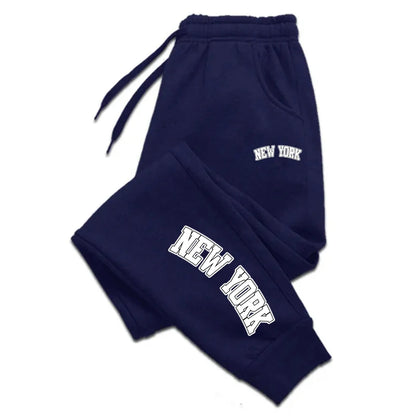 Unisex casual sports sweatpants in charcoal gray, slim jogger fit with elastic waistband and zip pockets