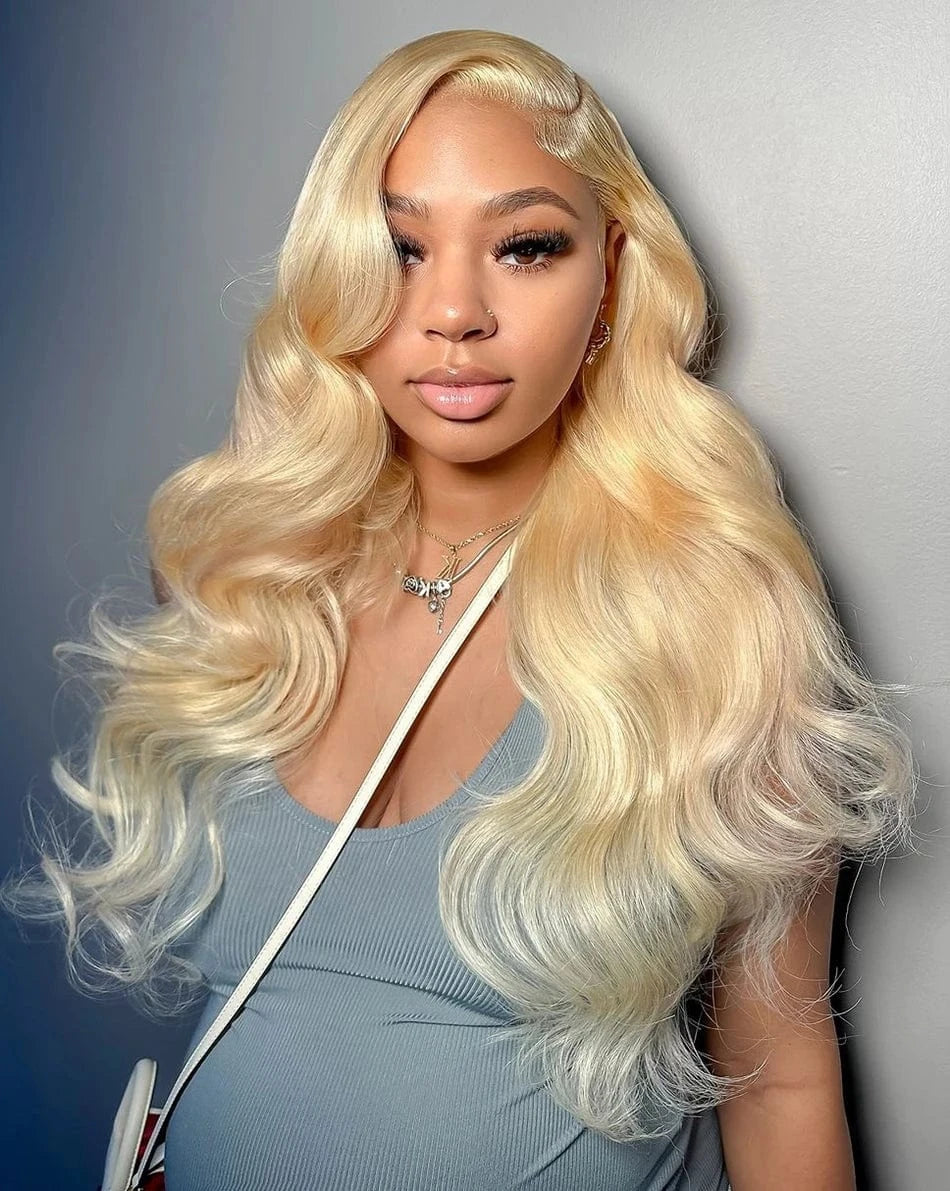 Woman with long blonde hair against a gray background