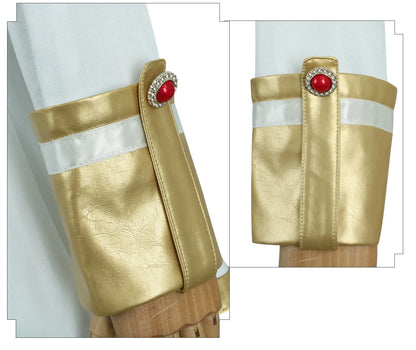 Gold arm guards with red gemstones on a white background