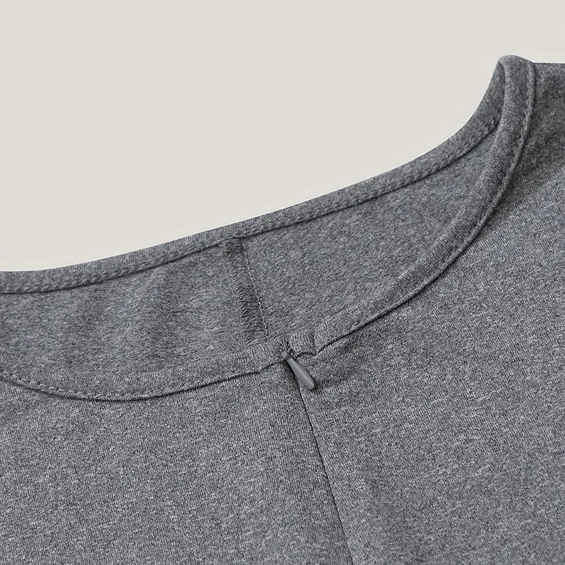Close-up of a gray garment with a collar on a beige background