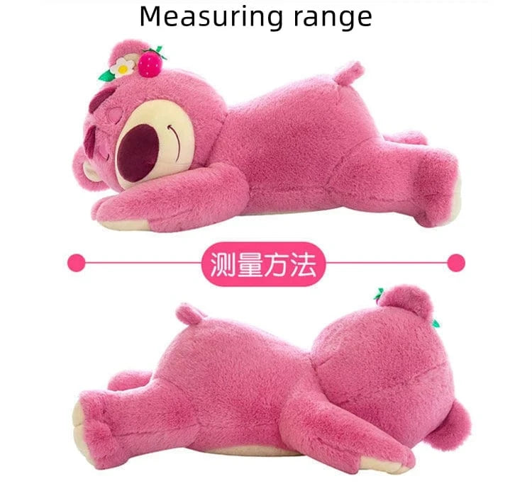 Pink plush toy with measurement indicators on a white background
