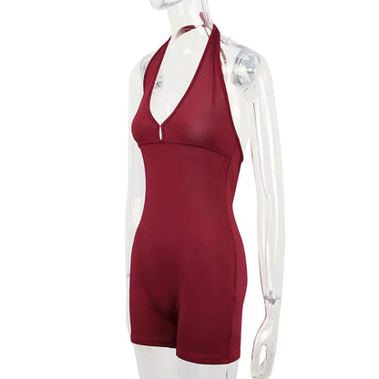 Red halter neck romper on a transparent mannequin against a white background