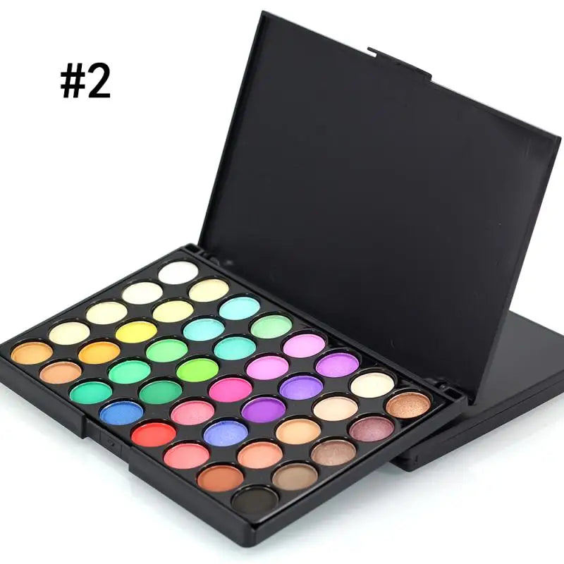 Makeup palette with various colors on a white background