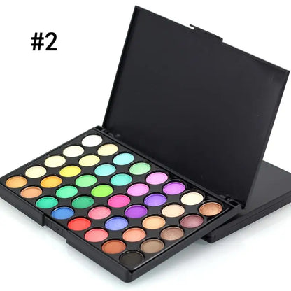 Makeup palette with various colors on a white background