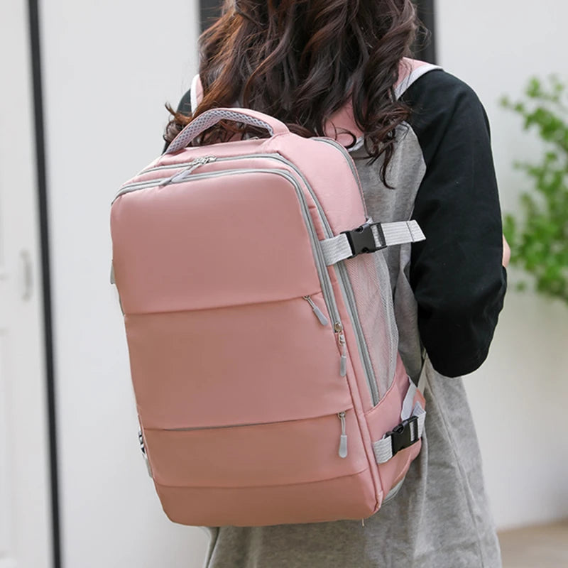 Person wearing a pink backpack with a blurred background