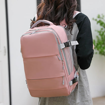 Person wearing a pink backpack with a blurred background