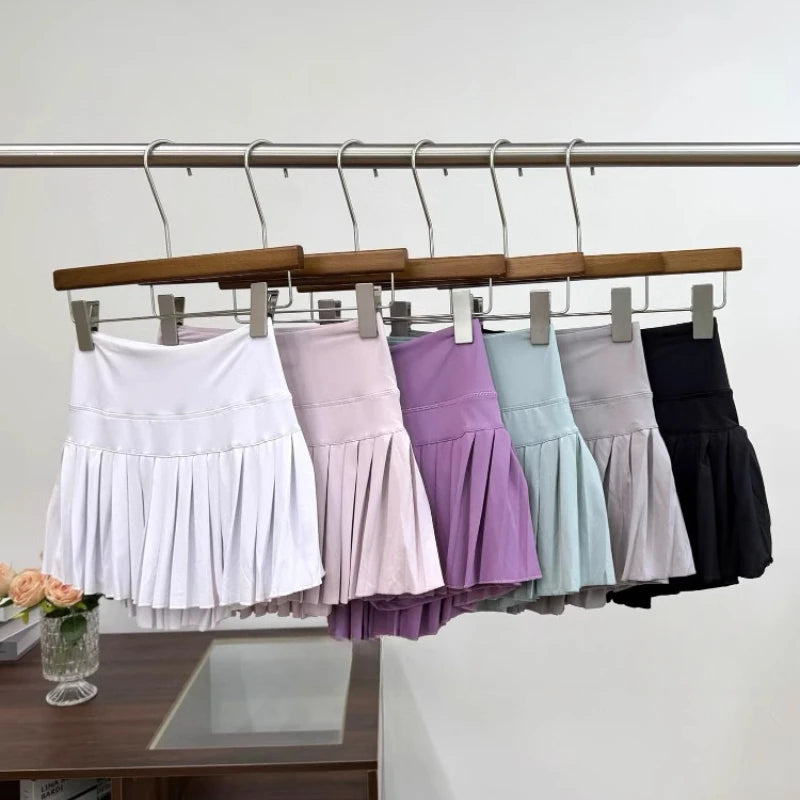 High-waist pleated tennis skirt pants with built-in shorts, breathable and lightweight for summer fitness activities
