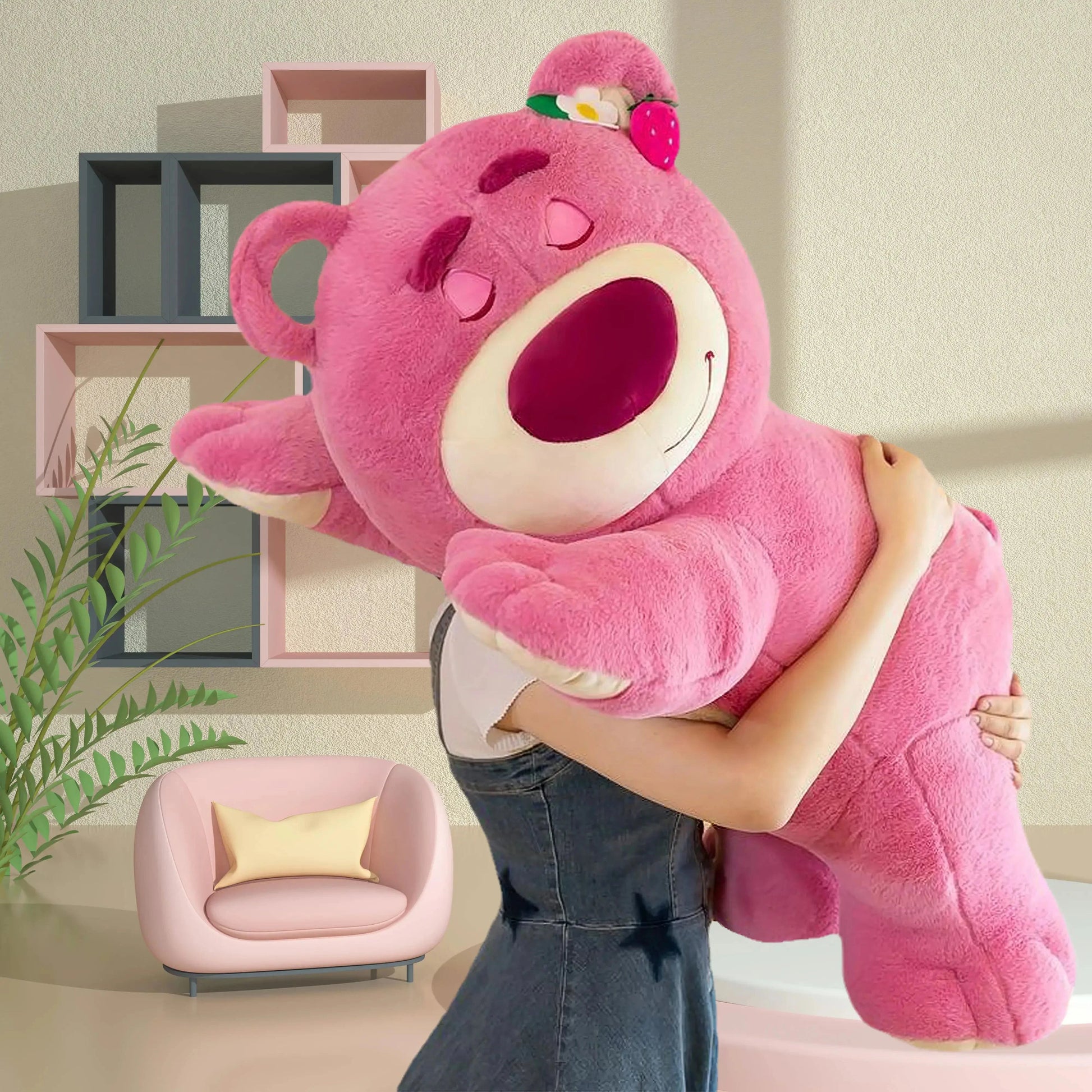 Person holding a large pink teddy bear in a room with a plant and shelves.