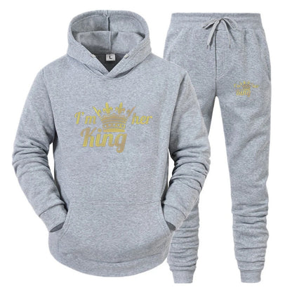 Gray hoodie and jogger set with 'I'm her king' text on a white background