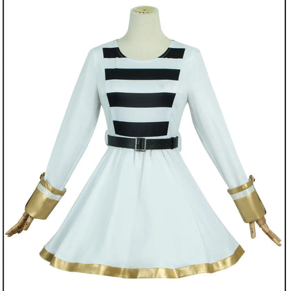 White dress with black and gold accents on a mannequin against a white background