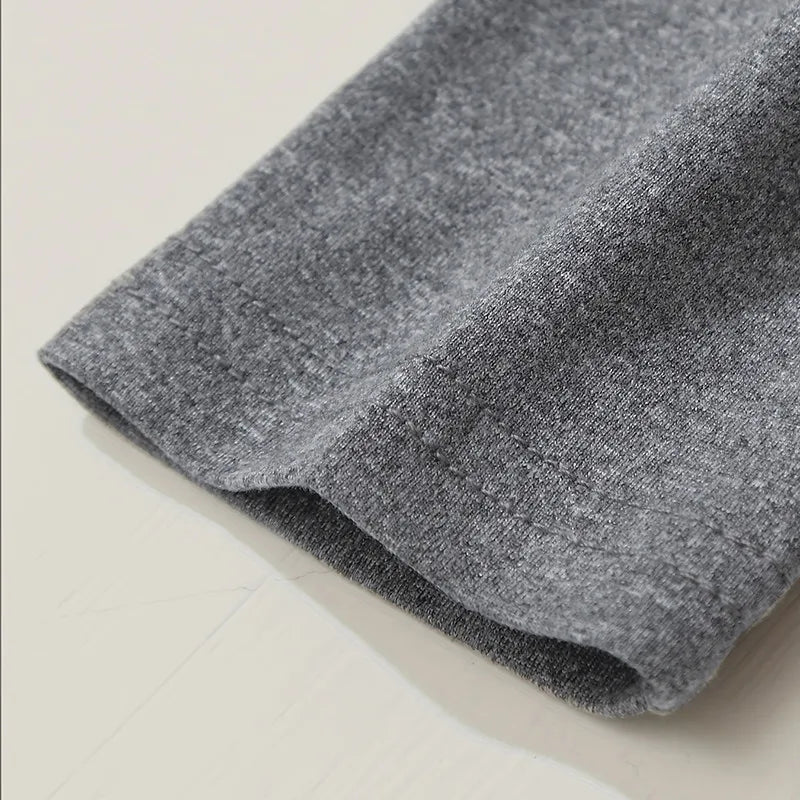 Gray fabric roll on a light beige surface