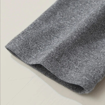 Gray fabric roll on a light beige surface