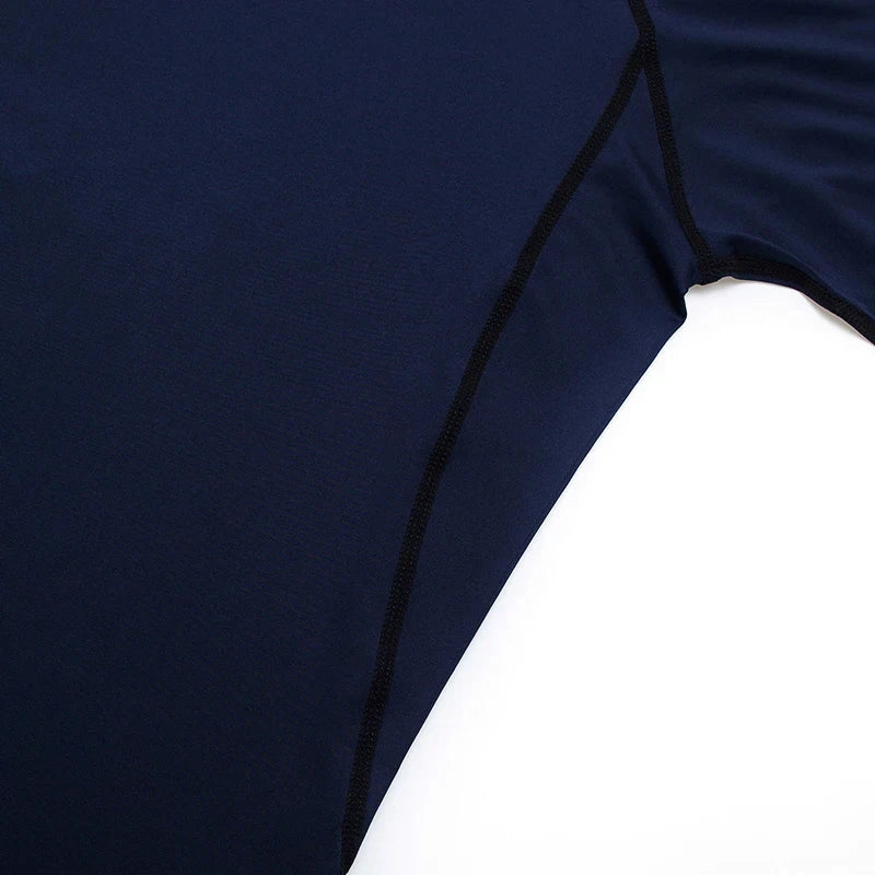 Close-up of a navy blue swimsuit with white trim on a white background
